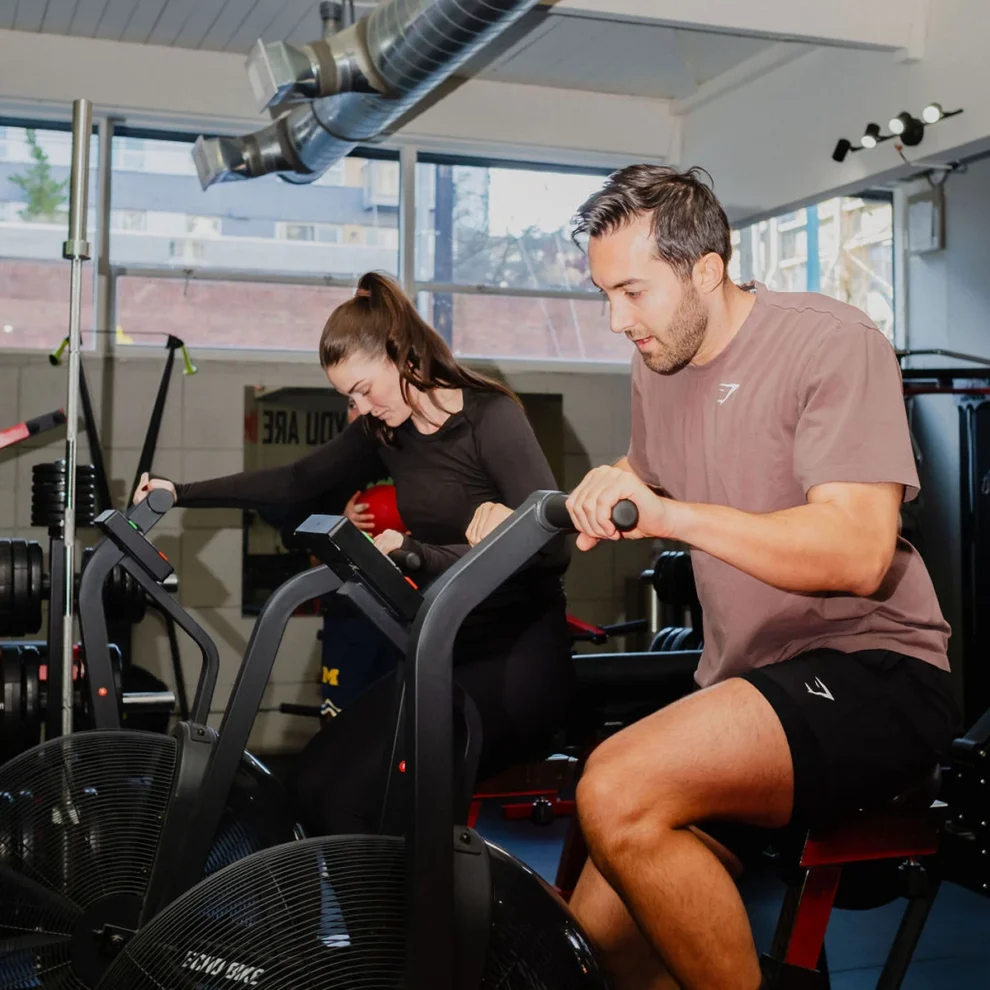 Partner training on echo bikes at Transform 180